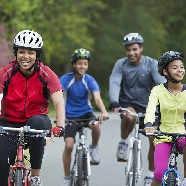 Photo of active family riding bikes